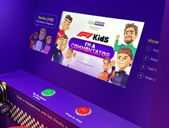 F1 fan recording a race commentary video at the beIN SPORTS commentary booth powered by qiksense.