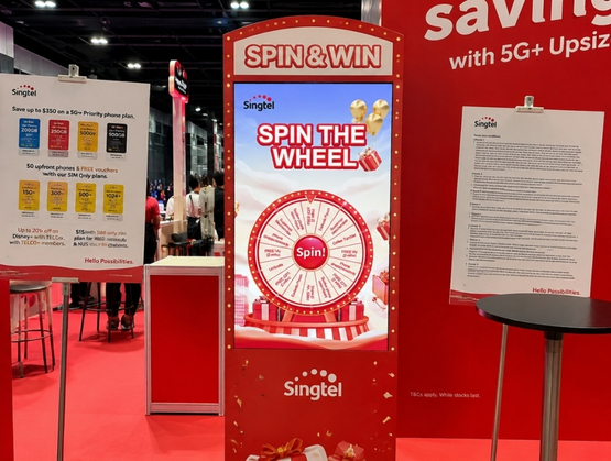 Singtel Spin the Wheel interactive campaign built using qiksense for event booths.