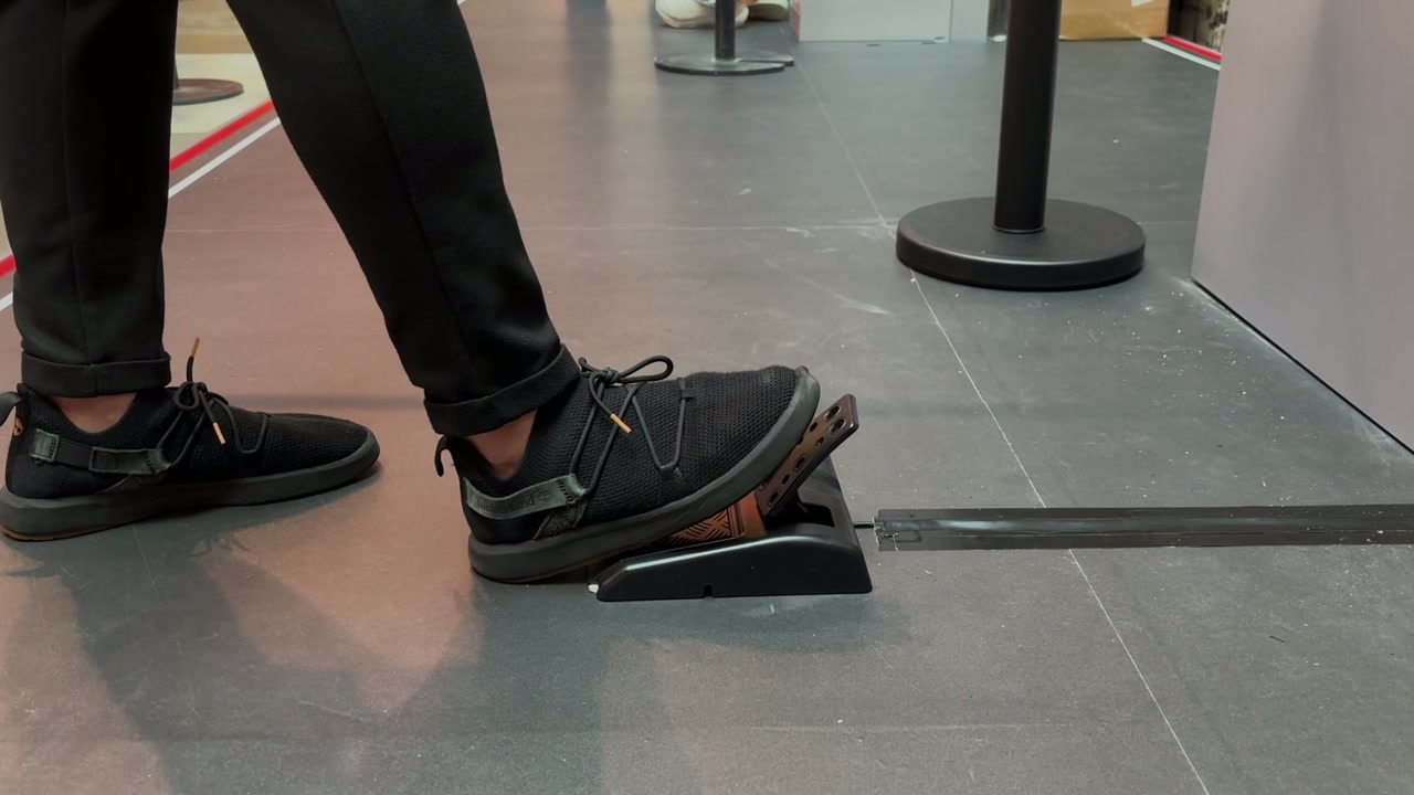 A player stamping on the foot pedal at the Lights Out Challenge