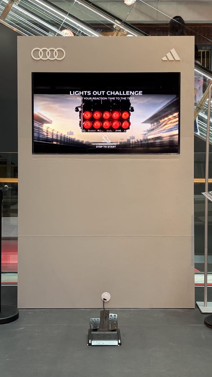 The Lights Out Challenge screen with a foot pedal on the floor in front of it