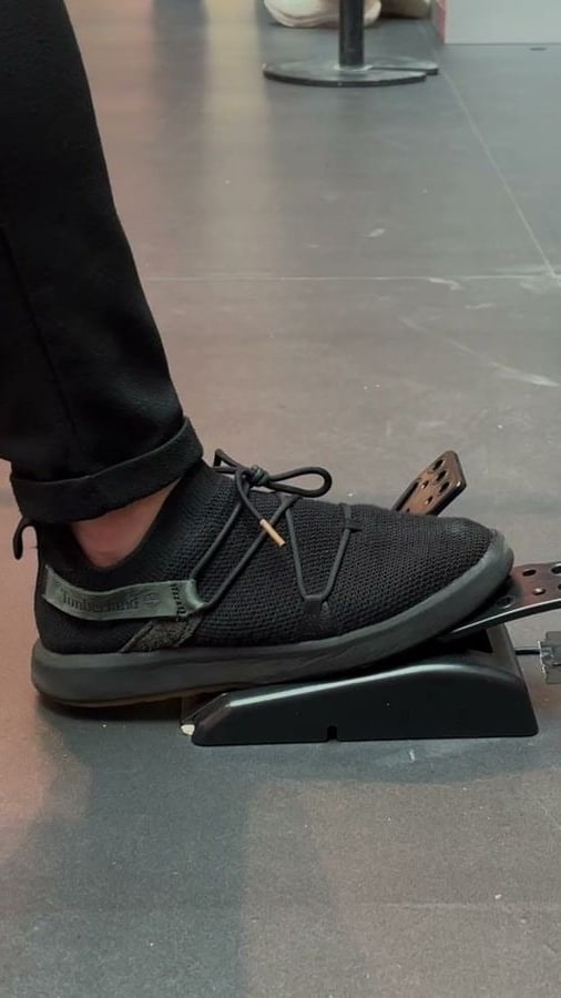 A player stamping on the foot pedal the moment the lights go out