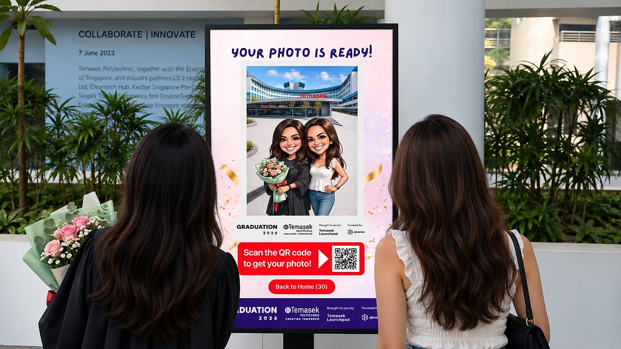 Temasek Polytechnic graduates viewing their AI caricature photo